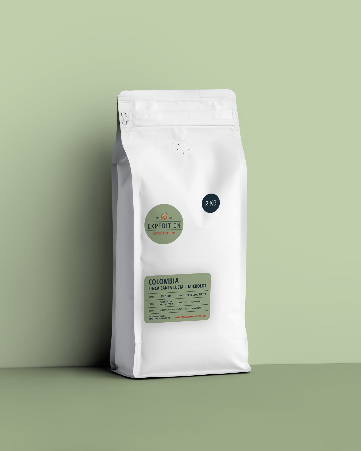 White coffee bag with green label on a light green background