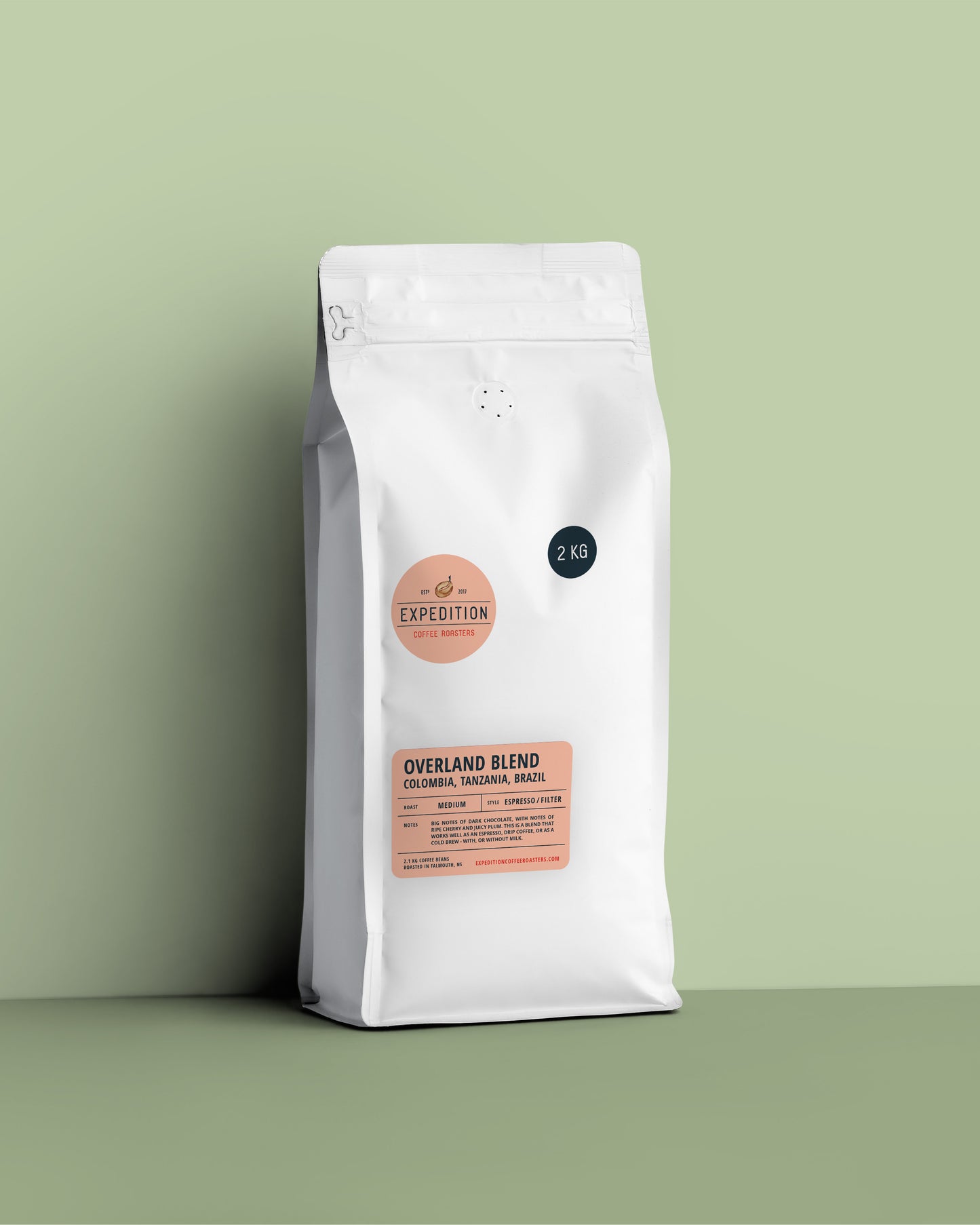White coffee bag labeled 'Overland Blend' on a green background