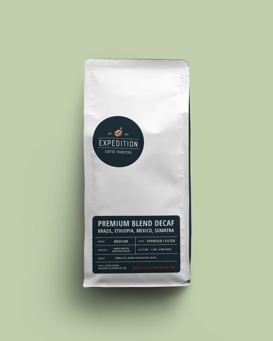 Premium blend decaf coffee bag mockup with navy labels from Expedition Coffee Roasters