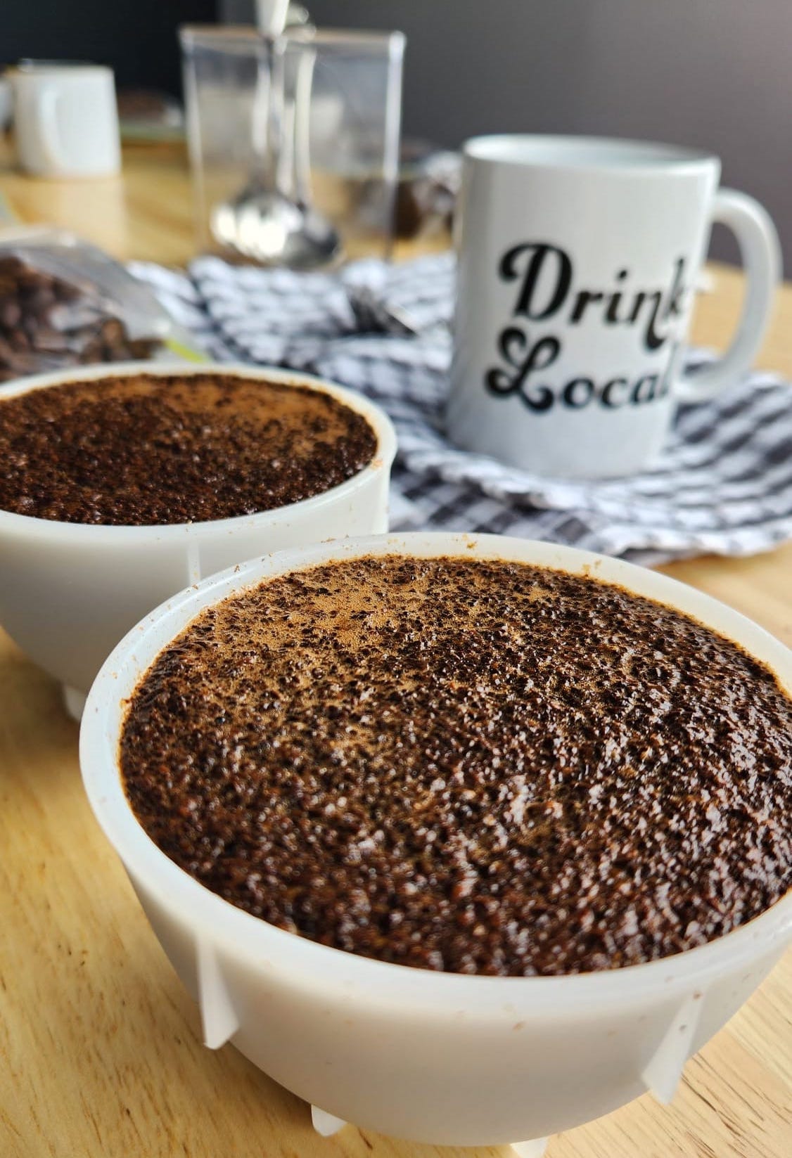 Aaron cupping coffee beans to evaluate his roasting process