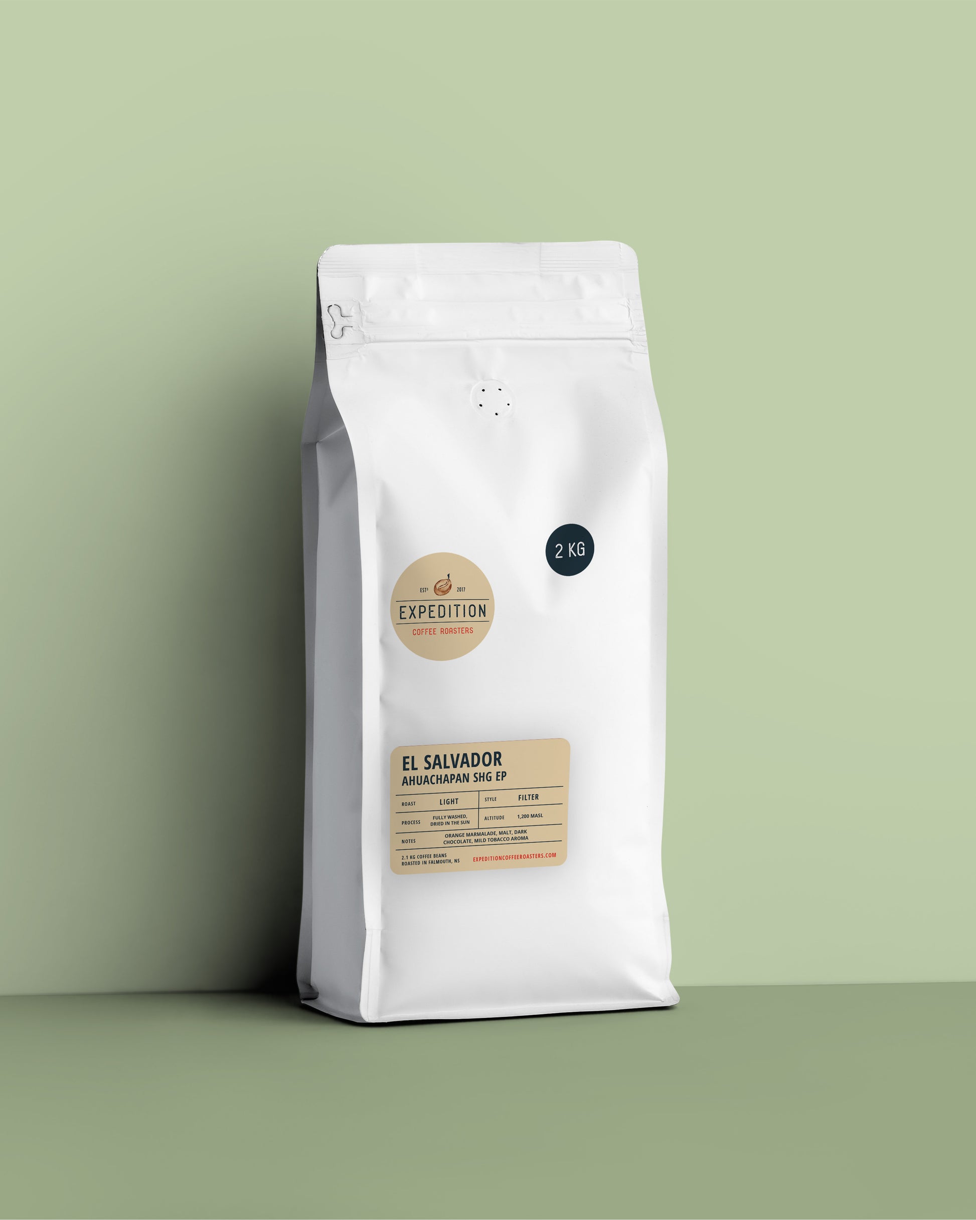 2.1kg bag of El salvador coffee beans from expedition coffee roasters in a white bag on a light green background