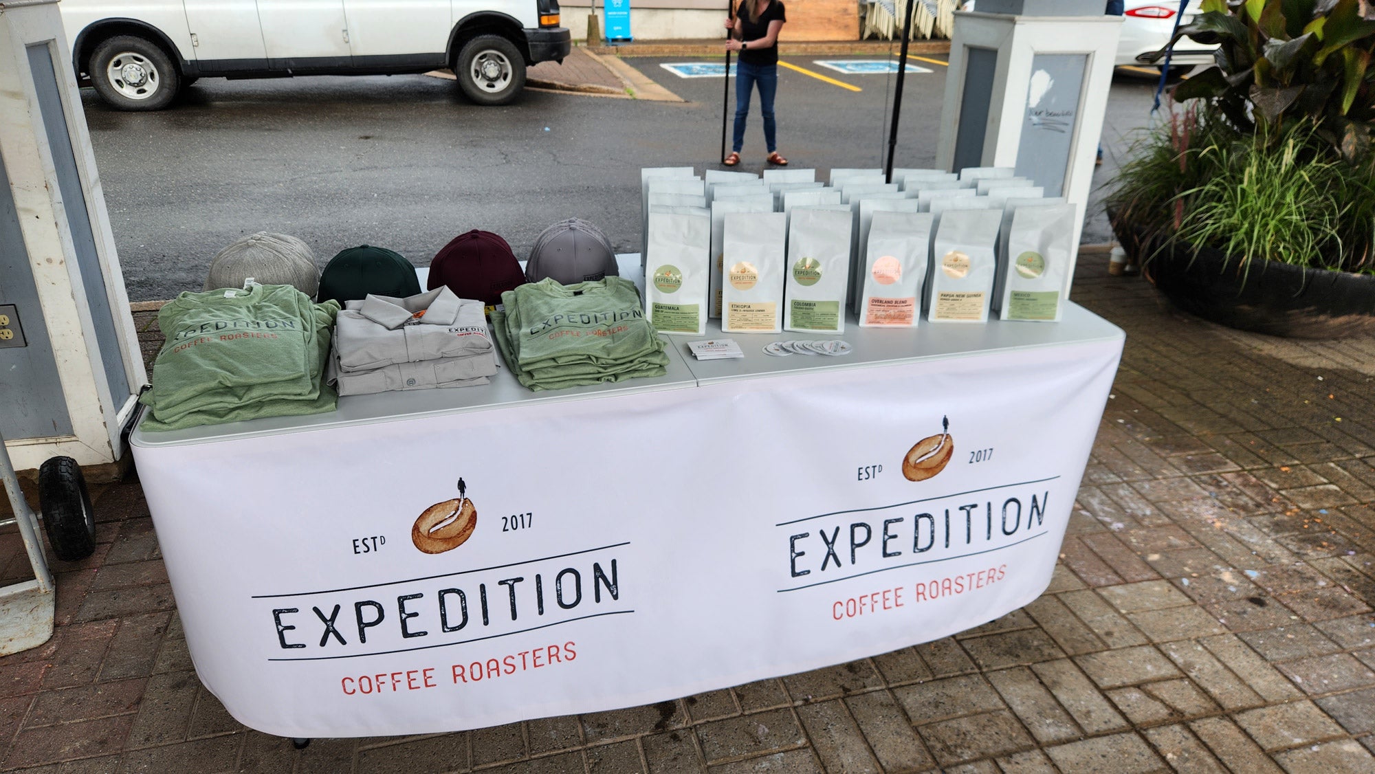 Expedition Coffee Roasters table at Kentville Night Market with coffee and merch