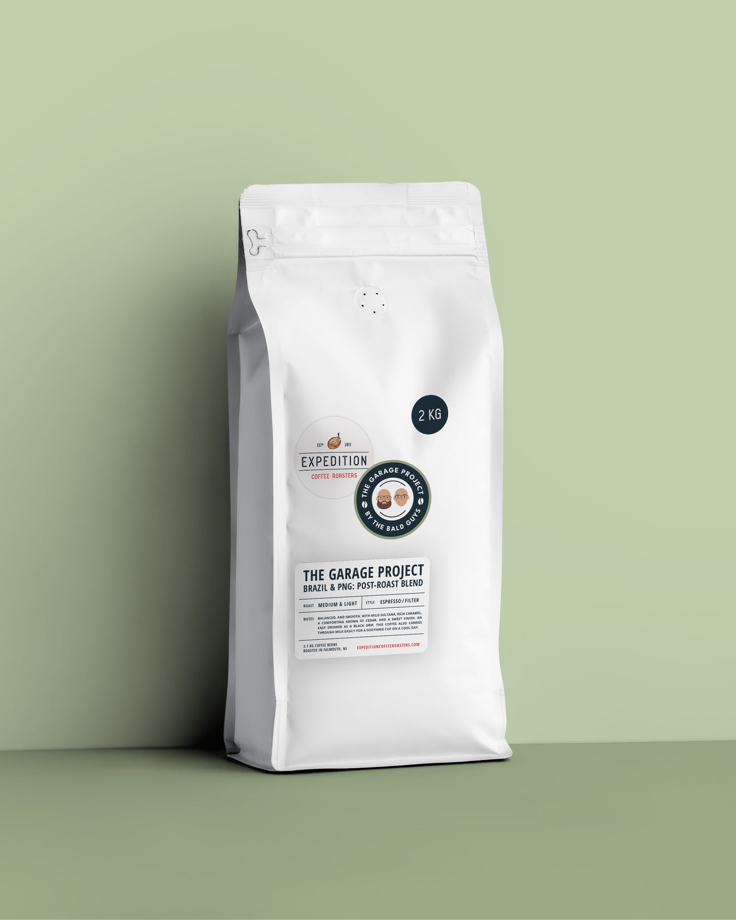 White 2kg coffee bag with a label on a green background, medium-light roast brazil and png coffee beans